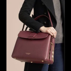 Burburry burgundy purse  - Condition: like new There is no obvious sign of worn internally or externally. I bought in the US for 1590 USD!