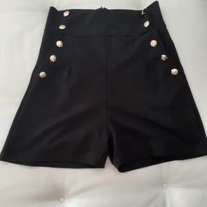 Black shorts with gold buttons and a side zip  - Size M  -Made and bought in Italy  💫Dont be hesitant to message for any questions about the product (Only in English) 💫