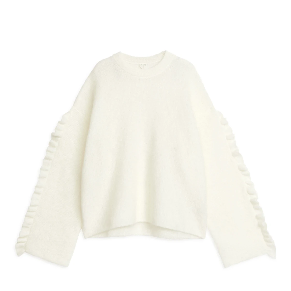 Vit stickad tröja med volangdetaljer