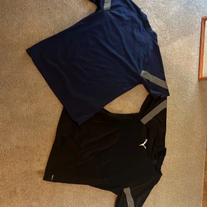 Träningskläder från Puma  - Tre par svarta träningshorts från Puma samt två trönigströjor i blått och svart från Puma.