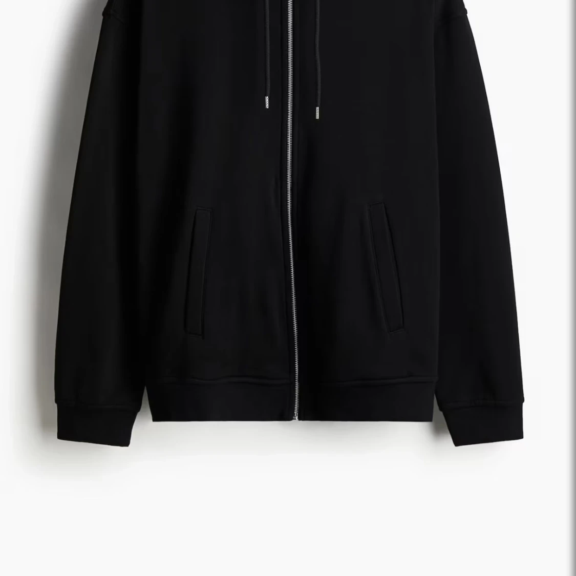 Svart hoodie med dragkedja från H&M