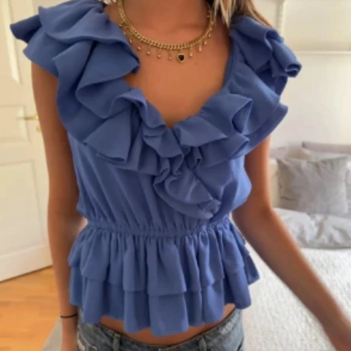 Blå volangtopp från H&M