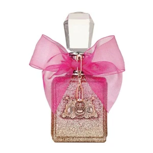 Viva La Juicy Rose Eau de Toilette - Säljer en lyxig parfymflaska med en glittrig design i guld och rosa. Flaskan har en elegant, facetterad kork och pryds av en stor rosa rosett. Perfekt för den som älskar glamour och stil. Använd 2ggr. Det finns förpacknkngen oxå ❤️
