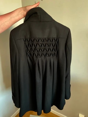 Kappa i äkta ull - Använd endast en gång, ångrat köp