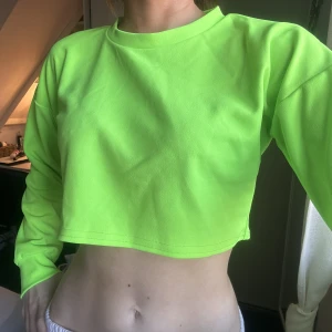 Neongrön magtröja - Neongrön. Magtröja. Använd en gång. 