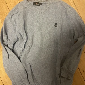 US polo  - Blå stickad tröja 