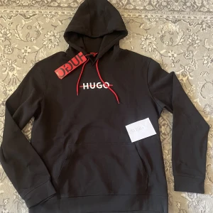 Hugo luvtröja  - Storlek XL passar även L 