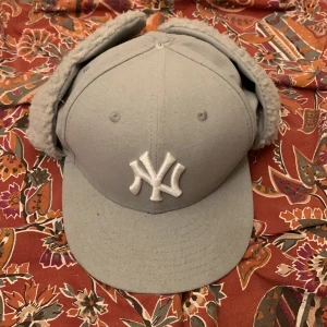 New York yankees fitted cap - I bought this at a thrift store thinking I was gonna be the shit then two days later I stopped using it realising that I looked like a dumb motherfucker. Btw on the top there is a button missing