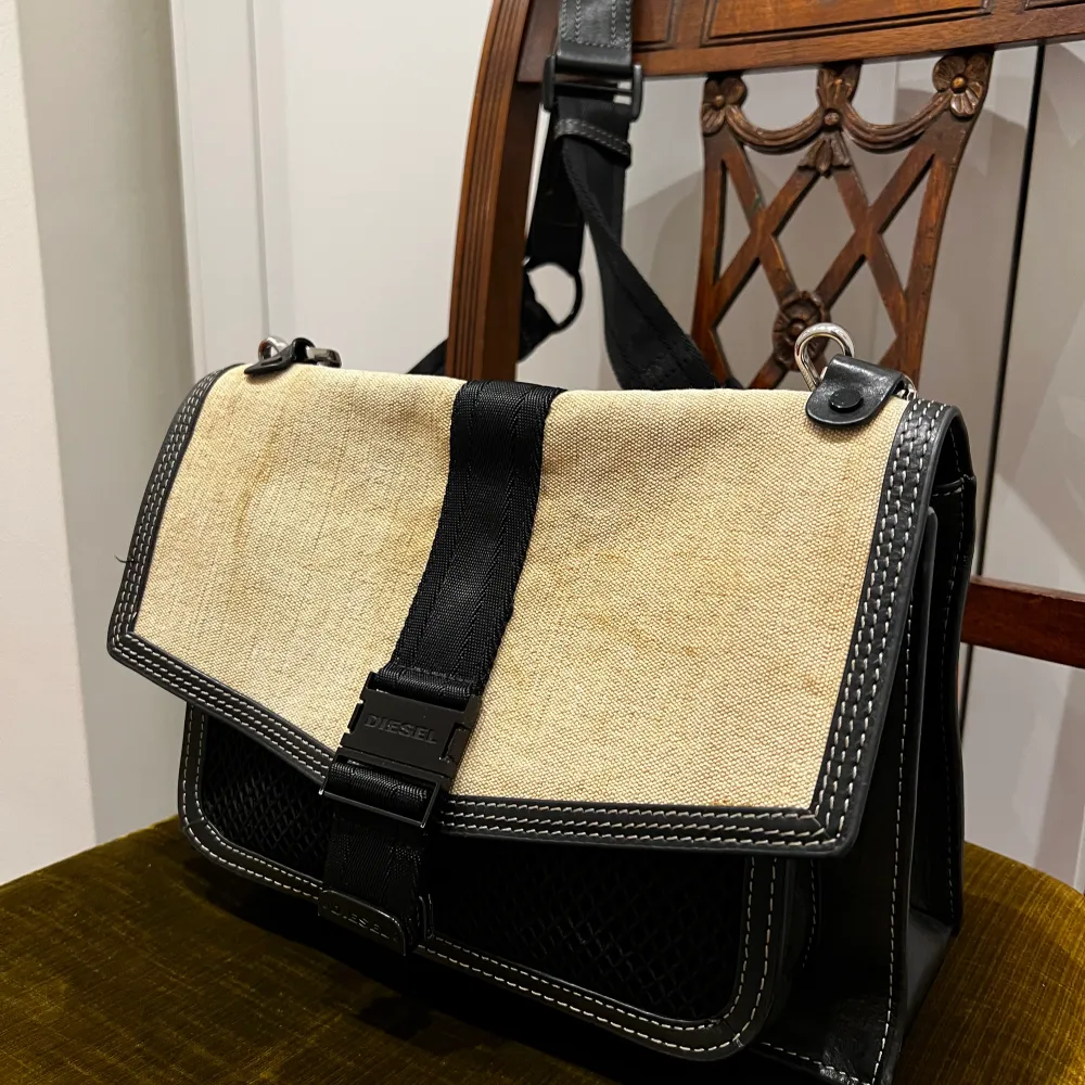 Crossbody Diesel bag- leather elements The flap material is distressed, this is an original feature  I love how it fits everything but not my style anymore. . Accessoarer.