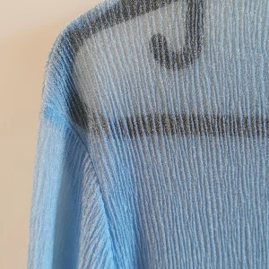 Glittrig blå tröja Junkyard stl S - En glittrig transparent tröja från junkyard i storlek S. Underbar blå färg! 