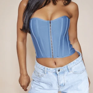 Corset top - Från prettylittlething. Sitter väldigt fint på och formar. Storlek 36! 