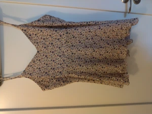 Pink Flowery blouse with open back - Good condition, good fit, used often