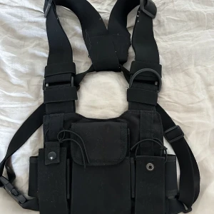 Cable Vest, BORNFROMPAIN - A black cable vest from the BORNFROMPAIN brand pre 2017.   Condition 7/10: Used 20+ times