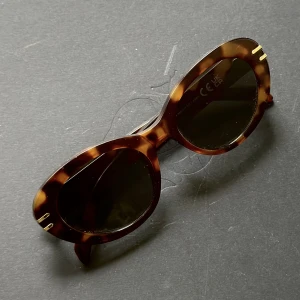 Solglasögon - Bruna