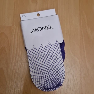 Lila fishnet strumpbyxor - Helt nya, oöppnad! Lila fishnet strumpbyxor från Monki