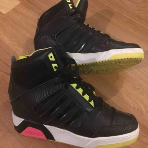  - Adidas Women Hi Top Trainer Sneakers Black/Pink Used but still in good condition. Size 39  *hidden wedge heel *lace-up design *Outer Material: Smooth Leather *Sole: Gum Rubber *Closure: Lace-Up *Heel Height: 2 inches *Heel Type: Wedge