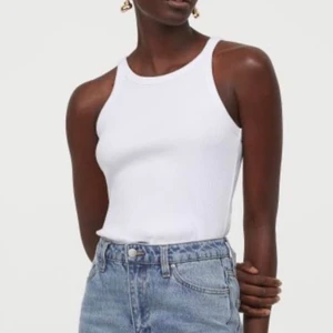 Basic white ribbed tanktop  - Like new, white ribbed tank top with a high neckline, bought recently and only worn a few times. No stains, it looks good with everything, it’s a must have! 