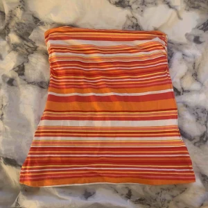  - Ett linne som används några gånger men är fortfarande i perfekt skick