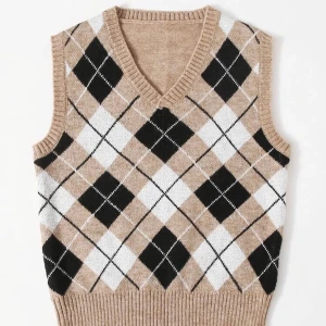 Beige rutig väst - Superfin väst i skönt material. Beige med rutigt svart och vitt mönster.