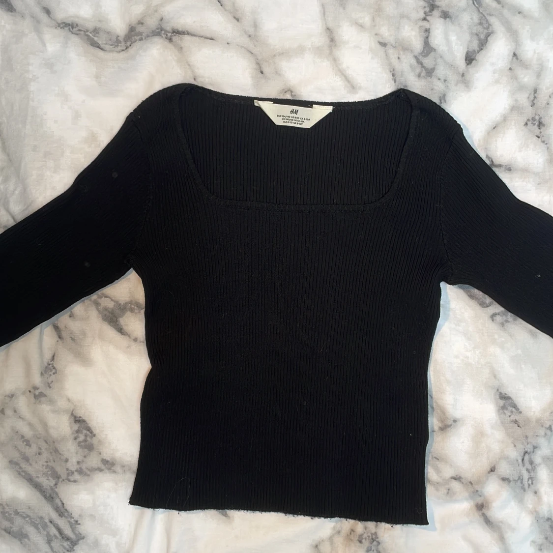 Svart ribbad topp från H&M