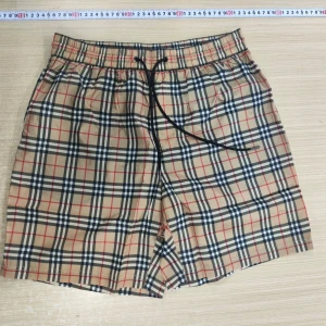 Beige rutiga shorts med snörning - Snap - fashion24sju alla strl