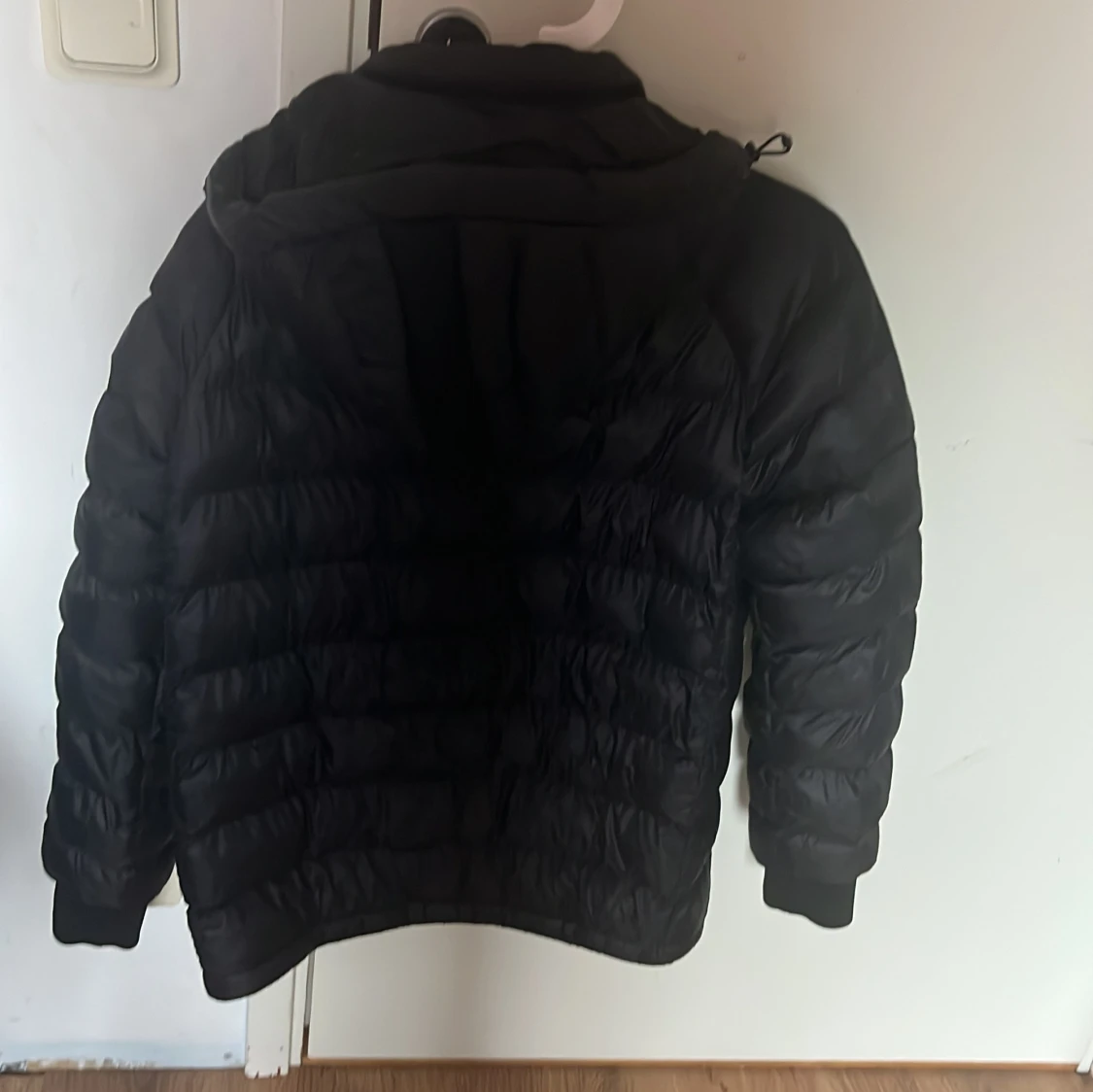 Svart dunjacka Peak Performance  - 2