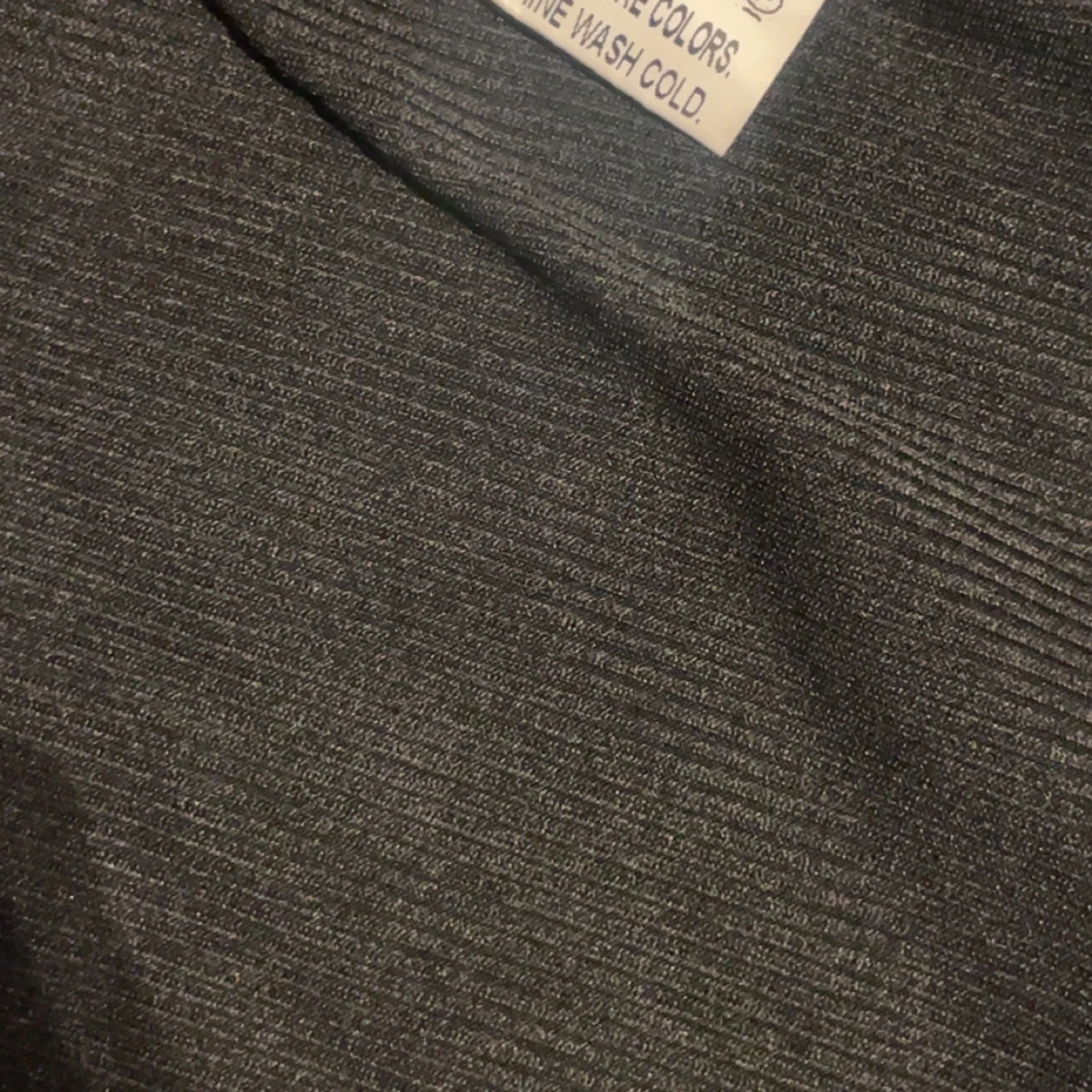 Svart ribbad långärmad tröja med knappar - 1