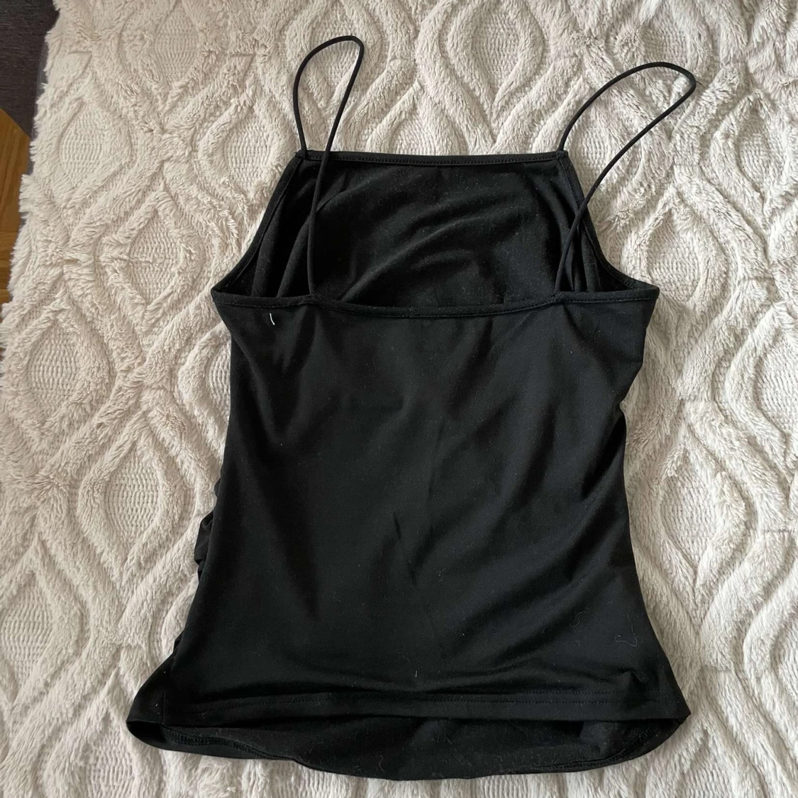 Svart ärmlös linnetopp