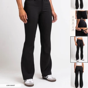 Svarta randiga kostymbyxor från Madlady - Snygga svarta kostymbyxor från Madlady med diskreta ränder. Byxorna har en dragkedja och knapp framtill. Byxorna är helt nya endast testade. Storlek EU 40, Längd Tall. 