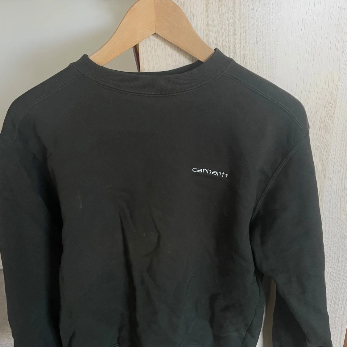 Mörkgrön sweatshirt från Carhartt