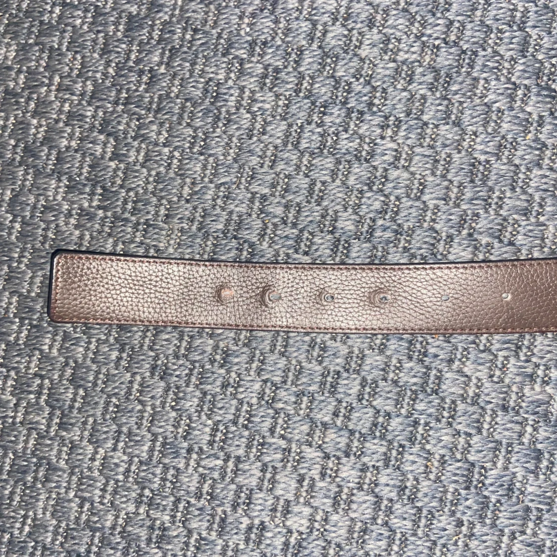 Svart och brunt skärp i skinn,Dio r - 2