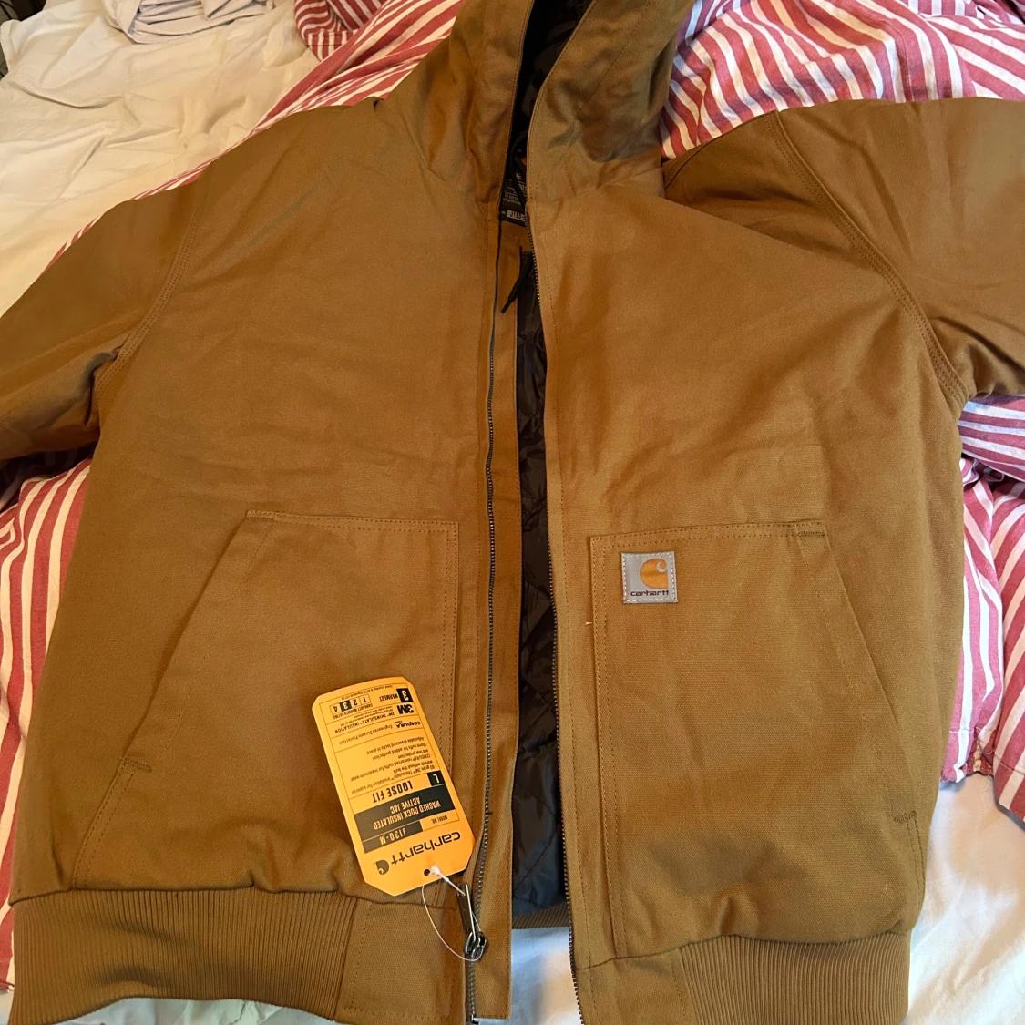 Aldrig använd Carhartt brun pufferjacka L