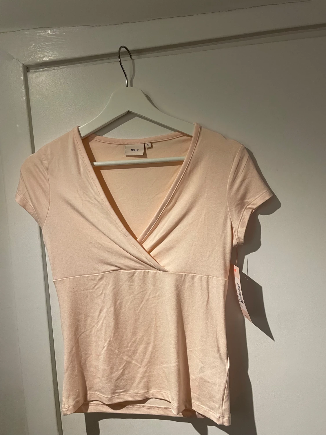 Ljusrosa omlottopp från Nelly - 2