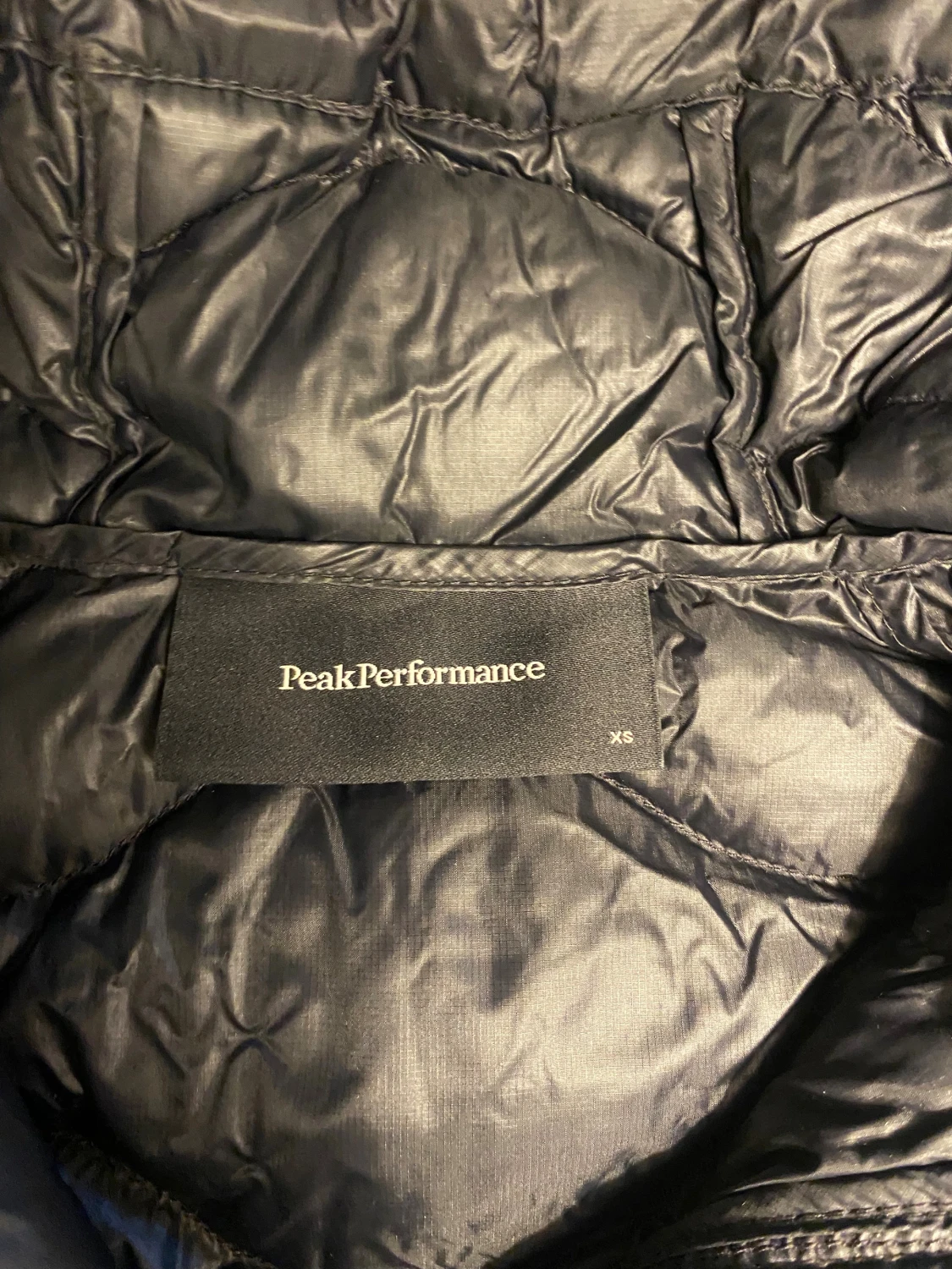 Svart dunjacka Peak Performance XS - 1