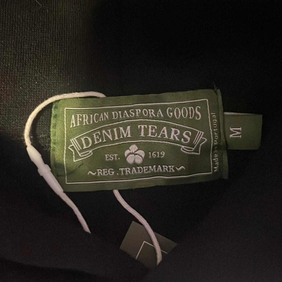 Svart hoodie från Denim Tears med blommor - 1