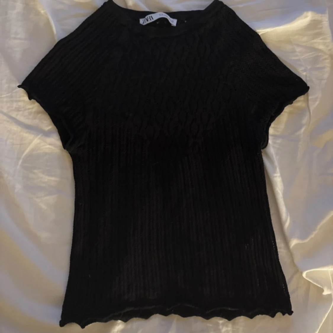 Svart ribbad topp från H&M