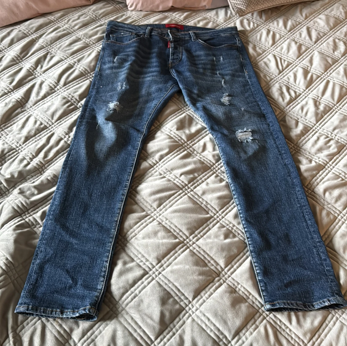 Blå Dsquared2 jeans med slitningar