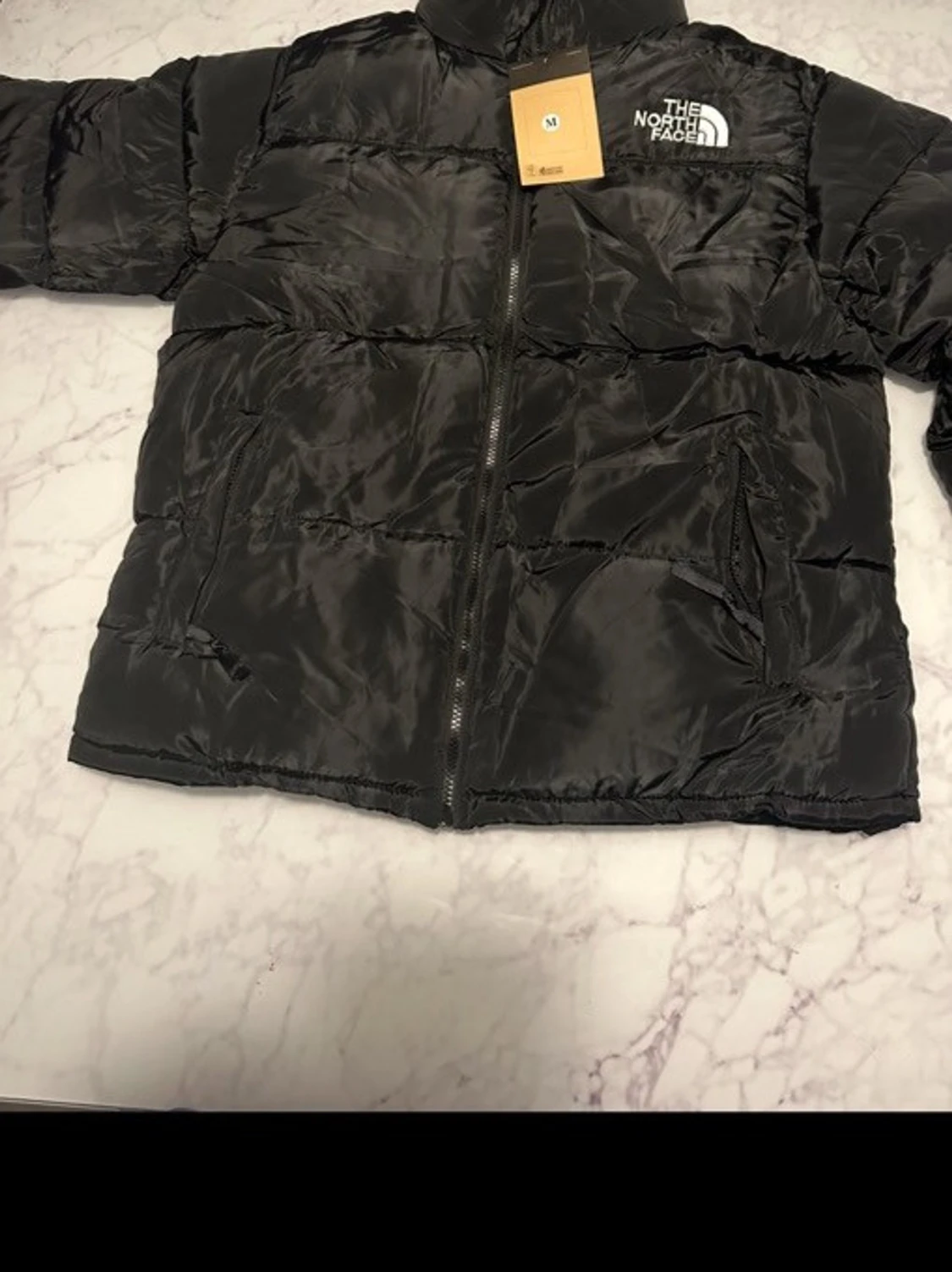 Svart pufferjacka från The North Face - 1