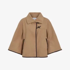 Beige Poncho från Vila  - Säljer denna poncho från Vila. Som du ser på bild 3 kan man även välja att ha armarna igenom öppningen där vid ärmen. Så sjukt snygg men måste rensa min garderob! Helt oanvänd! Köpte för 679, säljer för 150 kr. 