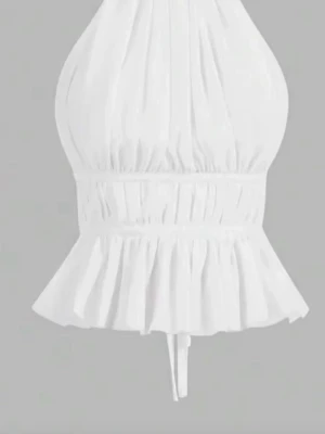 Vit back-less blus - Säljer en vit blus med volang nedtill. Toppen är backless och har knytband i ryggen för en snygg passform. Materialet är lätt och luftigt men inte genomskinligt.