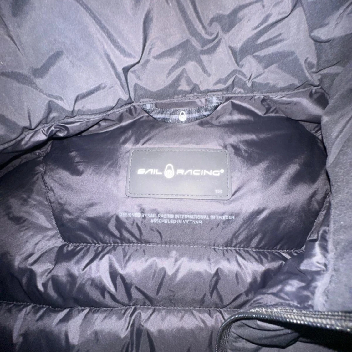Svart dunväst från Sail Racing - 2
