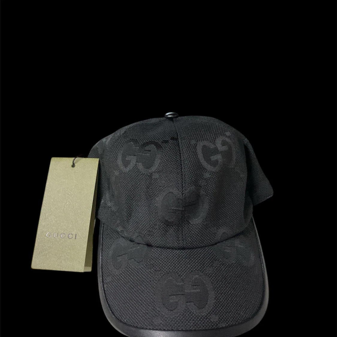 Svart keps från Gucci med GG-mönster