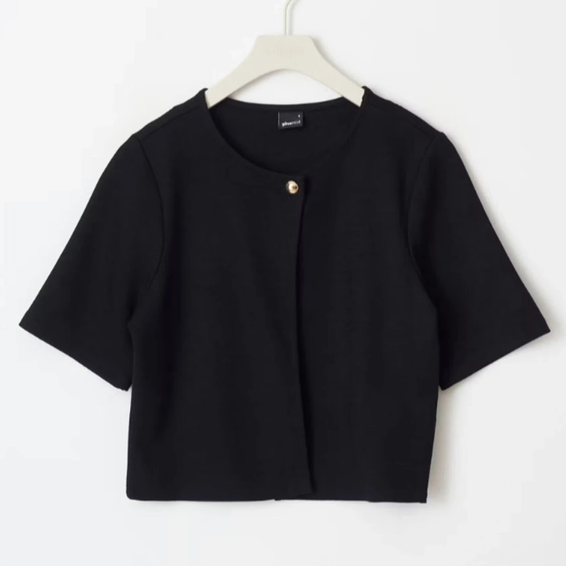 Svart croppad väst med knapp