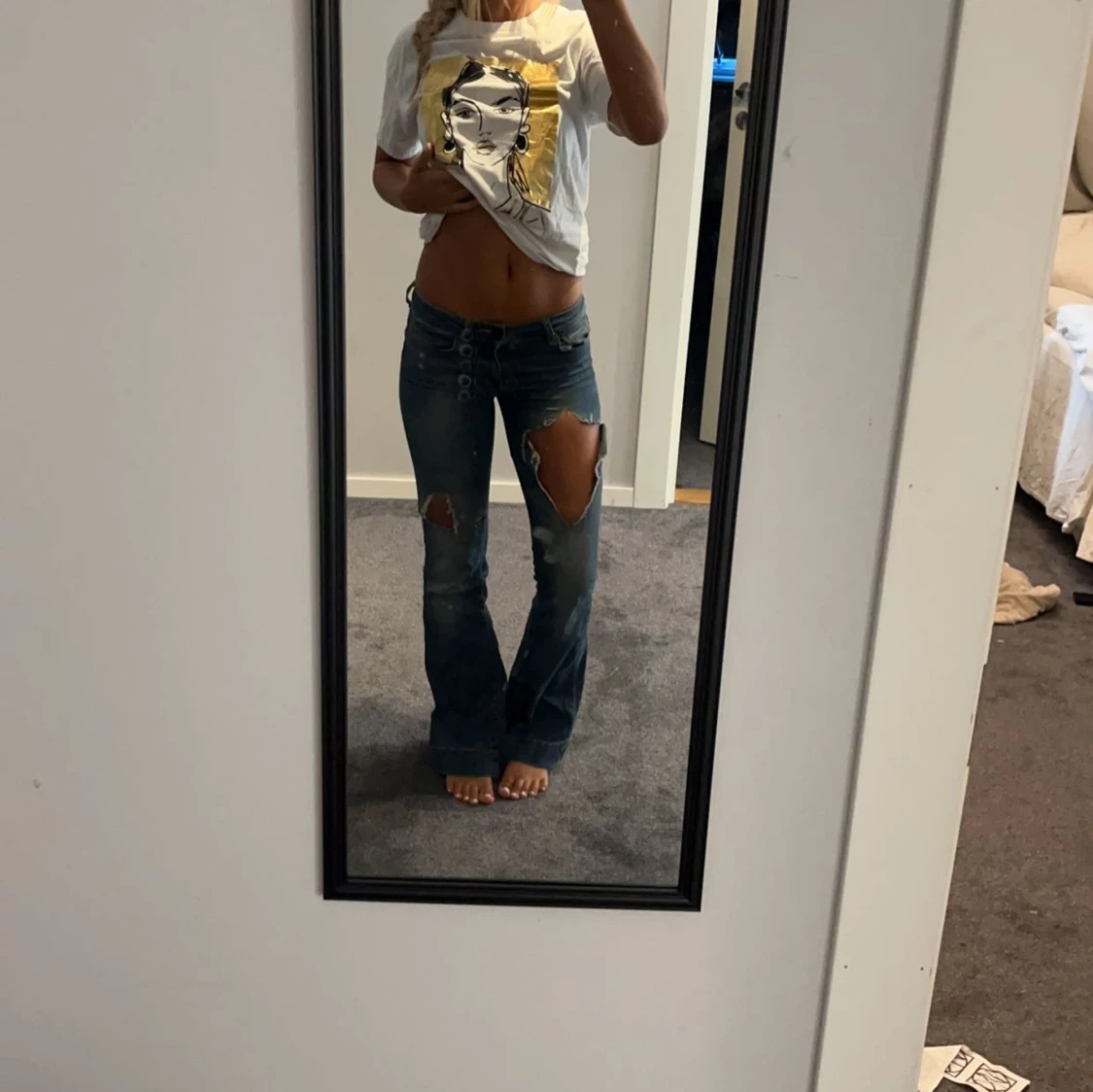 Blå bootcut jeans med stora hål - 1