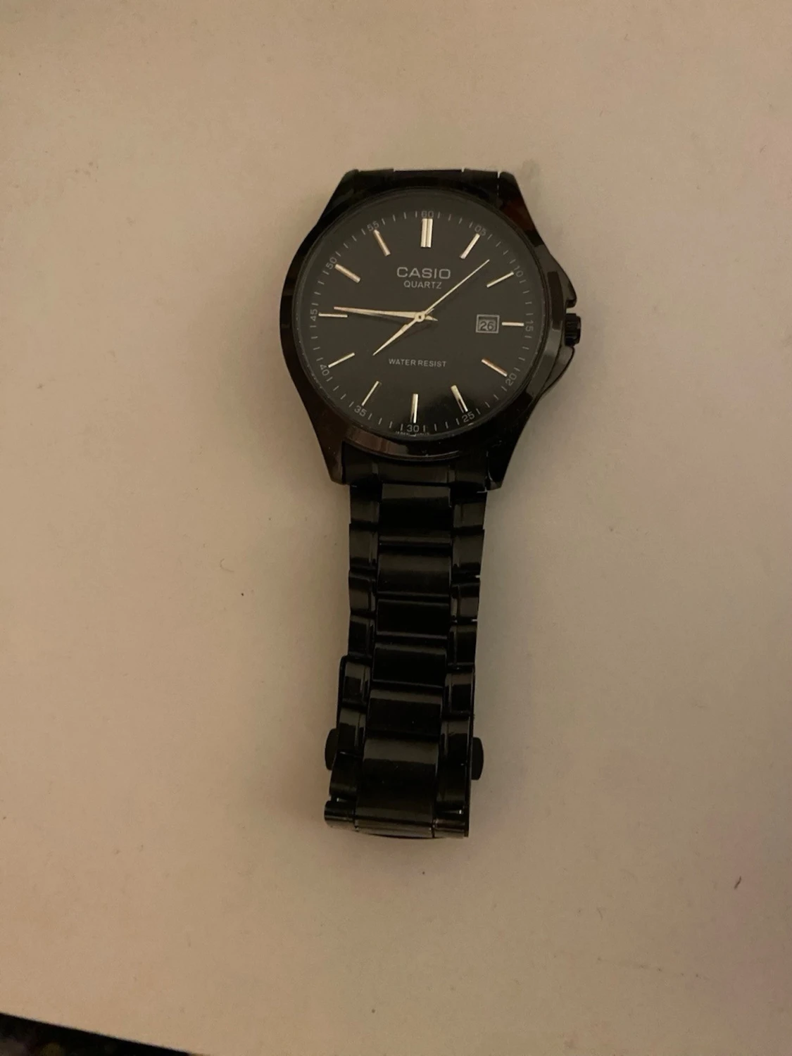 Svart Casio klocka med länkarmband