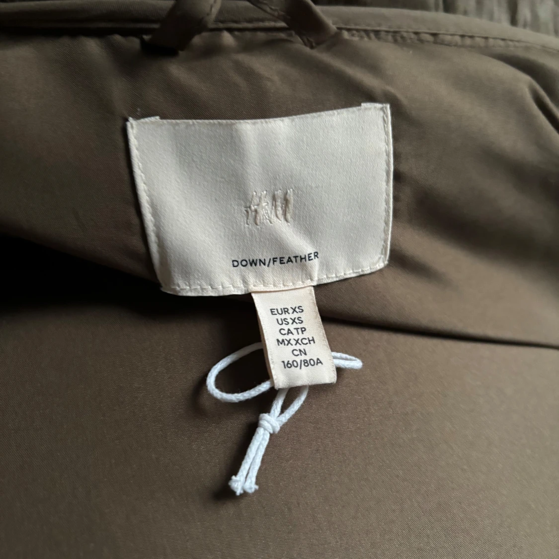 Brun dunjacka i storlek XS - 92