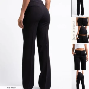 Svarta byxor med rak passform - Säljer ett par stilrena svarta byxor i midwaist-modell. De har en rak passform som ger en klassisk look och är perfekta för både vardag och fest. Byxorna är tillverkade i ett bekvämt material som sitter snyggt hela dagen. Byxor har en liten defekt (de sista bild) men som inte märks av när man har på sig. EU34TALL