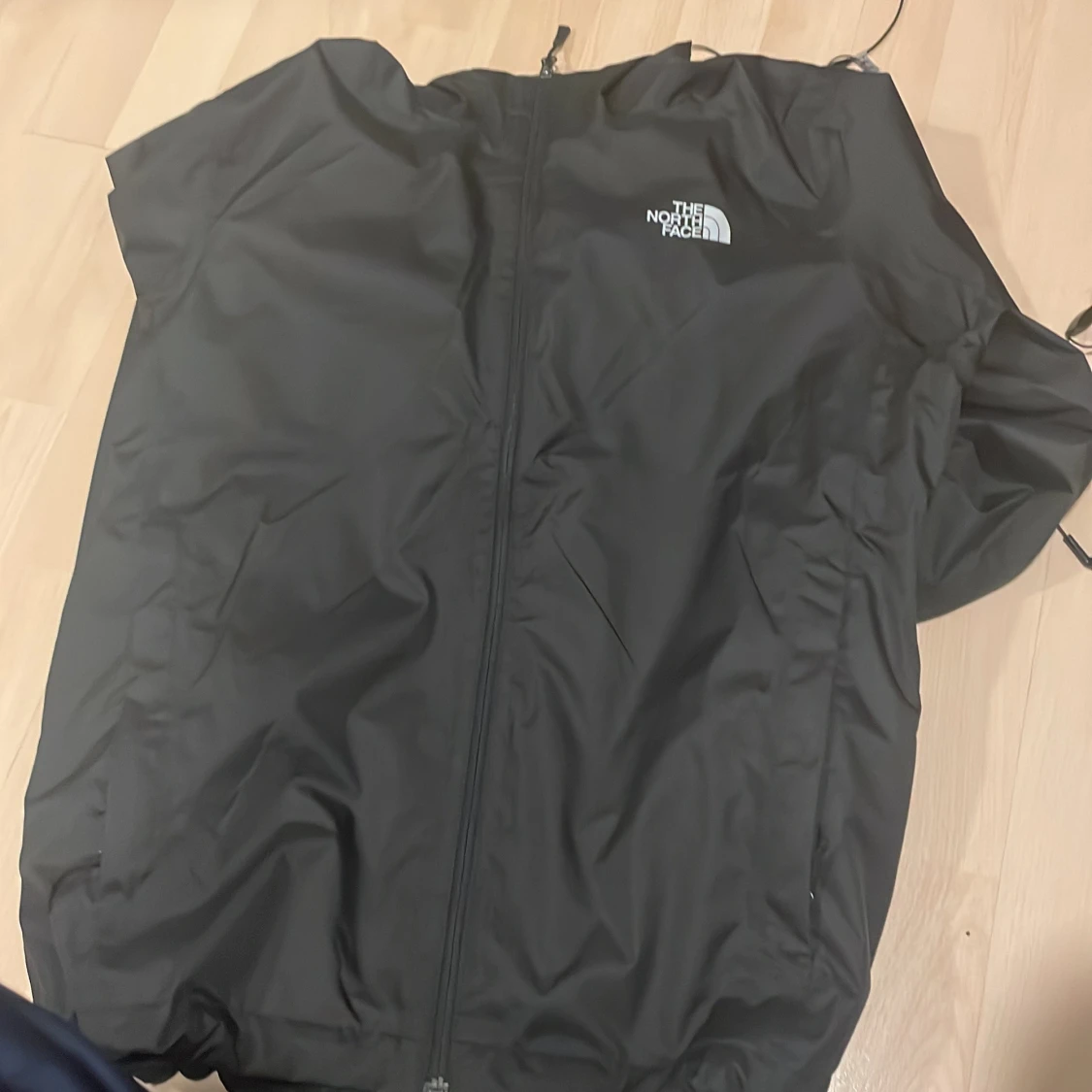 Svart vindjacka från The North Face