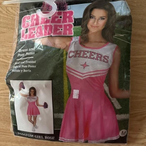 Halloween kostym  - Storlek m endast testad  Med Pom poms till 