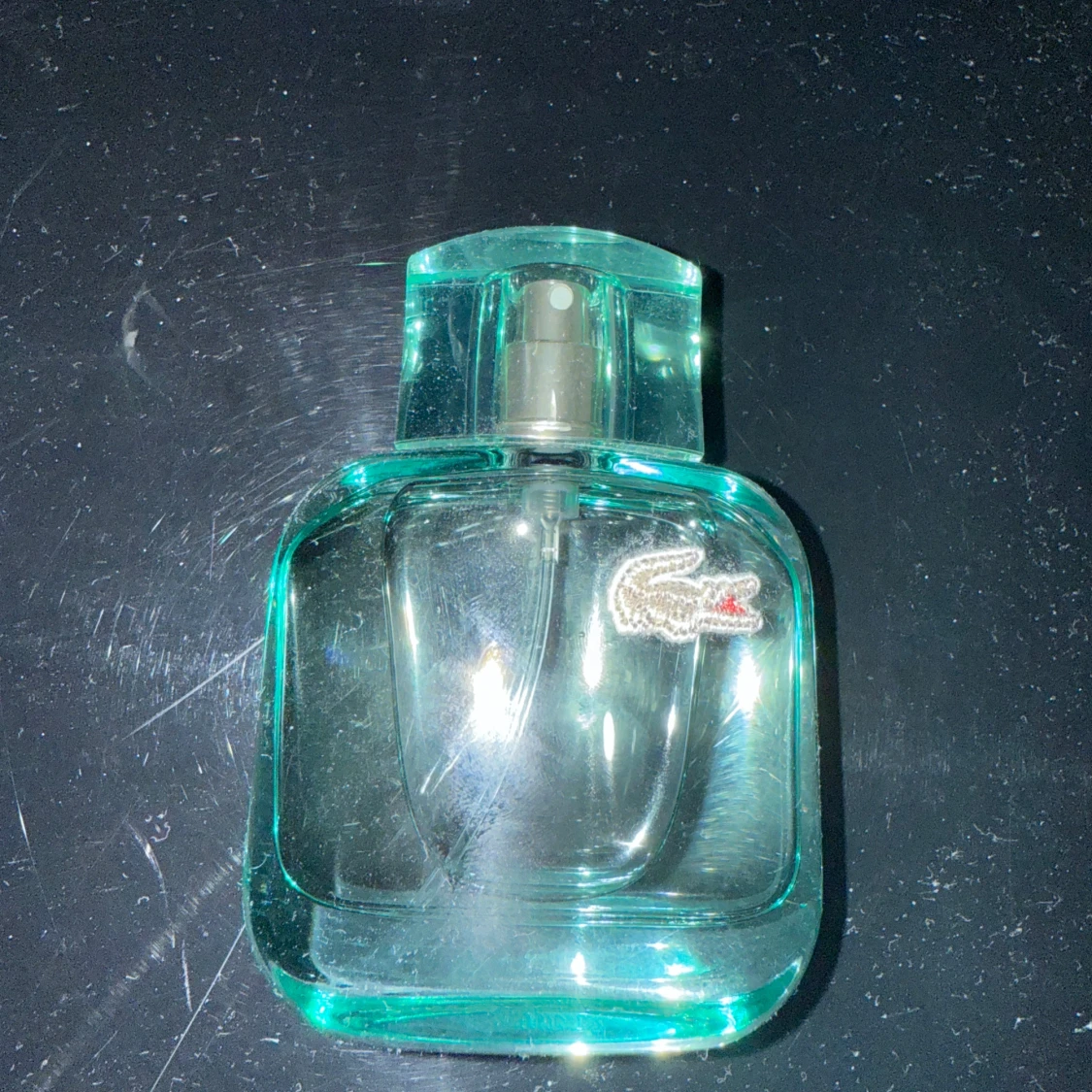 Grön parfymflaska från Lacoste - 1